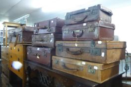 EIGHT VARIOUS SIZED BROWN LEATHER SUITCASES (8)