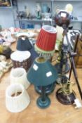 NINE VARIOUS TABLE LAMPS, ANOTHER IN THE FORM OF A SIMPLE OIL LAMP AND A MODERN COPPER METALLIC