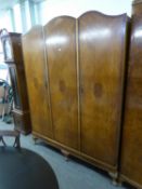 A QUARTERED ASH BEDROOM SUITE OF 2 PIECES, VIZ THREE DOOR WARDROBE AND A MILLINERY CABINET, WITH