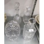 TWO SQUARE CUT GLASS CRYSTAL DECANTERS, A CUT GLASS WINE DECANTER AND A BASKET PATTERN FRUIT BOWL (