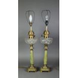 PAIR OF OIL TABLE LAMPS, EACH WITH ONYX COLUMN, brass square base and capital, cut glass reservoir