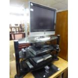 DMTECH SMALL FLAT SCREEN TELEVISION, ON BLACK GLASS STAND, WITH ACCESSORIES