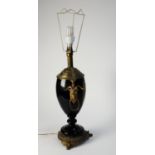 LATE NINETEENTH CENTURY GILT METAL MOUNTED MIDNIGHT BLUE GLASS TABLE LAMP, of two handled urn form