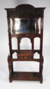 LATE VICTORIAN CARED OAK HALLSTAND, the arched top with foliate scroll carved panel, set above