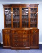 GEORGE III STYLE MAHOGANY AND SATINWOOD BANDED BREAKFRONT LIBRARY BOOKCASE WITH SECRETAIRE DRAWER,