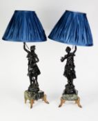 PAIR OF EARLY 20th CENTURY BLACK PAINTED SPELTER FIGURAL TABLE LAMPS, in the form of country