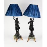 PAIR OF EARLY 20th CENTURY BLACK PAINTED SPELTER FIGURAL TABLE LAMPS, in the form of country