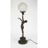 ART DECO STYLE BRONZED COMPOSITION FIGURAL TABLE LAMP in the form of a semi-naked female dancer