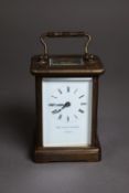 MATTHEW NORMAN BRASS CARRIAGE CLOCK, with Roman dial, oblong top glass and shaped top carrying