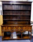 TWENTIETH CENTURY REPRODUCTION OAK DRESSER WITH PLATE RACK, the moulded cornice above shaped