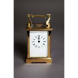 ACG BRASS CARRIAGE CLOCK, with Roman dial and polished brass case with moulded corners, oblong top