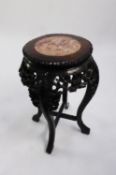 EARLY TWENTIETH CENTURY CHINESE CARVED HARDWOOD AND PINK VEINED MARBLE JARDINIÈRE STAND, the