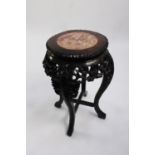 EARLY TWENTIETH CENTURY CHINESE CARVED HARDWOOD AND PINK VEINED MARBLE JARDINIÈRE STAND, the