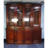 NINETEENTH CENTURY OAK BREAKFRONT LIBRARY BOOKCASE, the moulded cornice above four glazed cupboard