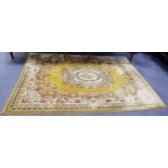 WASHED CHINESE CARPET OF AUBUSSON DESIGN, with off-white and floral centre medallion, on a plain