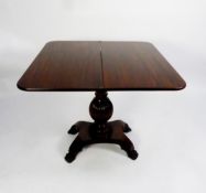 WILLIAM IV FIGURED AND CARVED MAHOGANY PEDESTAL TEA TABLE, the rounded oblong fold-over top above