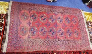 TURKOMAN BOKHARA FLAT WEAVE LARGE KELIM RUG, with two rows of seven large primary guls on a pink