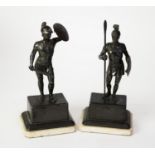 PAIR OF EARLY 20th CENTURY BRONZED METAL FIGURES OF ROMAN WARRIORS, with ferrous metal shields,