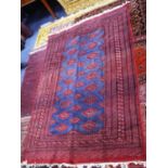 PAKISTAN BOKHARA CARPET, the blue field filled with red, white and orange primary guls, multiple
