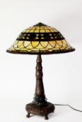 POST-WAR TIFFANY STYLE TABLE LAMP with muchroom shaped shade on a bronze effect moulded
