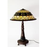 POST-WAR TIFFANY STYLE TABLE LAMP with muchroom shaped shade on a bronze effect moulded