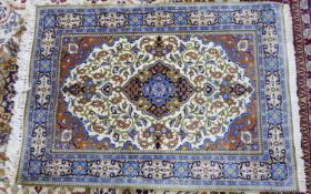 KERMANSHAH, PERSIAN RUG WITH CENTRE LOZENGE AND PETAL SHAPED MEDALLION with elaborate pendants,