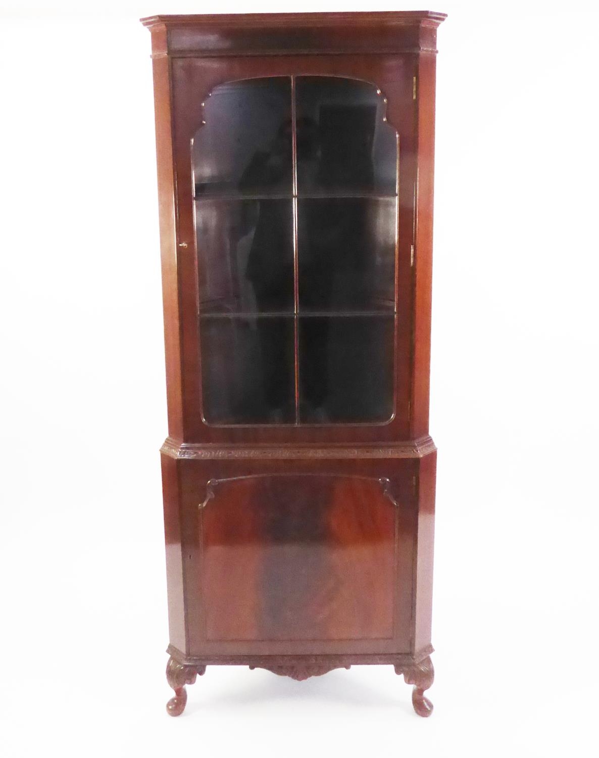 GEORGIAN STYLE MAHOGANY DOUBLE CORNER CUPBOARD, with astragal glazed door over a panel door, on