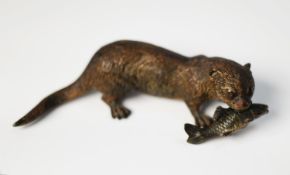 COLD PAINTED BRONZE MODEL OF AN OTTER, modelled with fish in its mouth, 6 ¼? (15.9cm) long, unmarked