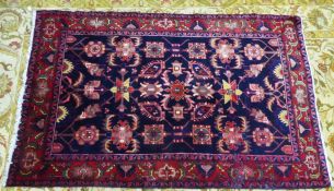 HAMADAN PERSIAN RUG with multi-coloured all-over formal floral pattern on a black background, the