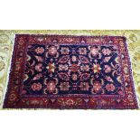 HAMADAN PERSIAN RUG with multi-coloured all-over formal floral pattern on a black background, the