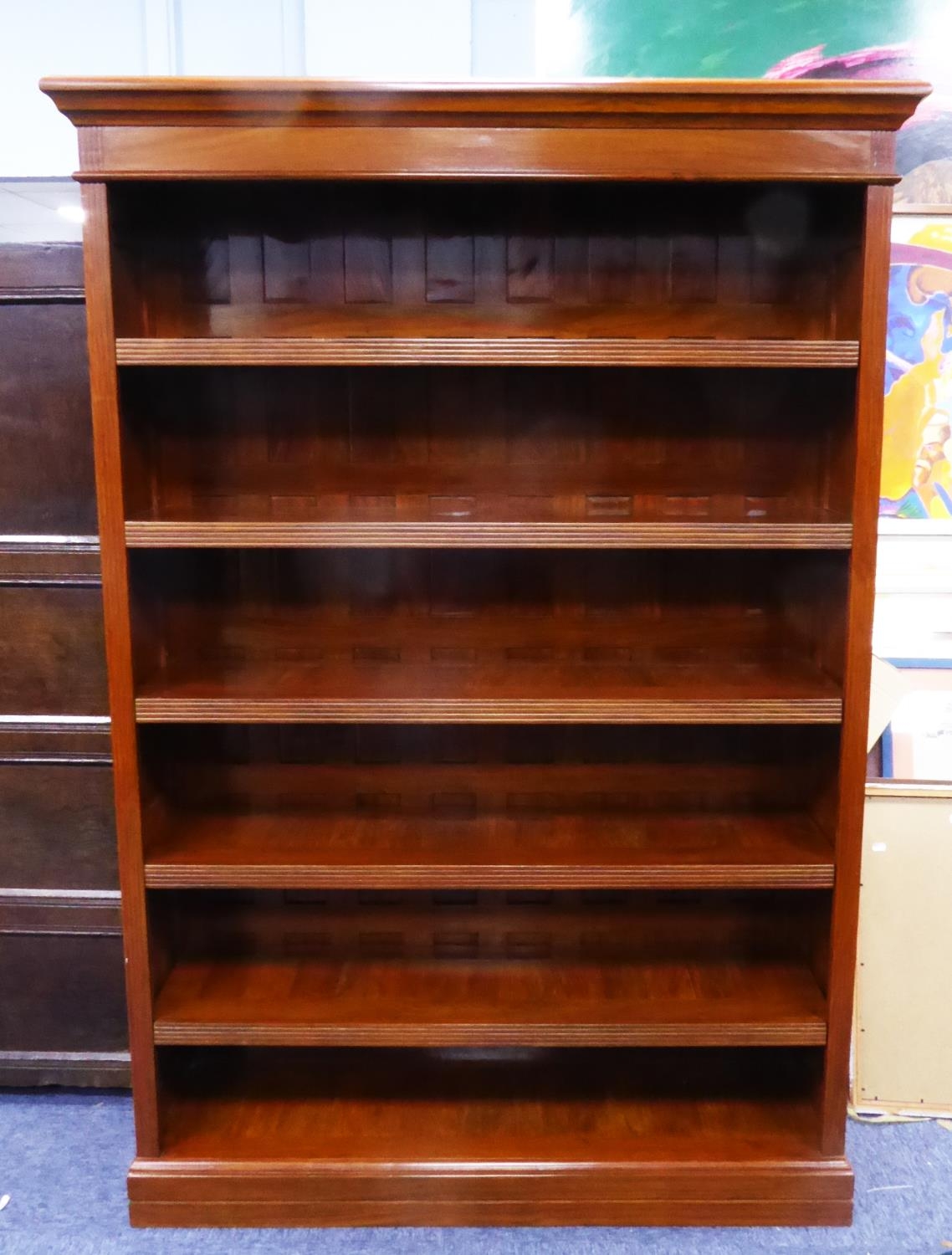 MODERN WALNUT LARGE OPEN BOOKCASE, the moulded cornice above five shelves with reeded fronts, to the