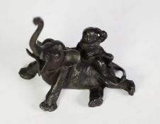 CHINESE LATE 19th/EARLY 20th CENTURY DARK BRONZE PATINATED WHITE METAL GROUP, boy seated on the back