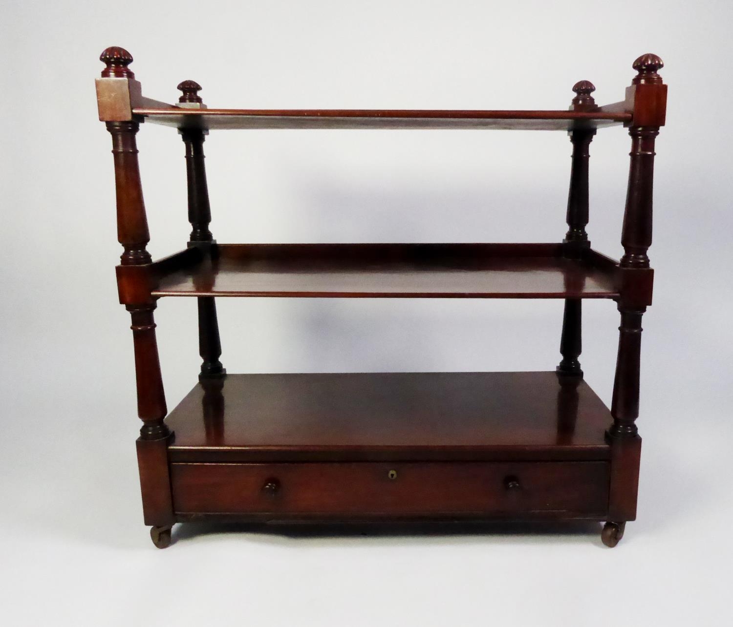EARLY VICTORIAN MAHOGANY THREE TIER DUMB WAITER, with turned supports, cockbeaded drawer to the base