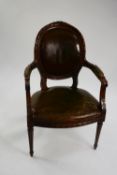 19TH CENTURY CARVED MAHOGANY LIBRARY OPEN ARMCHAIR, the oval back panel, elbow rests and seat