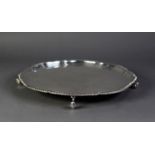 SILVER LARGE, PLAIN CIRCULAR SALVER, with shaped and step moulded border with gadroon edge, raised