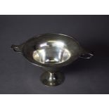 EDWARDIAN SILVER CIRCULAR DEEP BOWL, with lug and scroll handles, on waisted stem and circular foot,