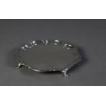 SILVER CIRCULAR CARD TRAY with shaped and step moulded border, raised on four pad feet, 6 ¼? (15.