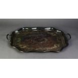 ELECTROPLATED ENGRAVED TWO-HANDLED TRAY, with wavy cavetto sides, 22 ½? (57.1CM) long over the