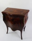 LOUIS XV STYLE MAHOGANY AND KINGWOOD BOMBÉ COMMODE with all-over floral and rococo foliate scroll