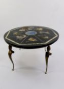 CIRCULAR COFFEE TABLE WITH BLACK SLATE TOP, decorated to imitate pietra dura, on four brass caryatid