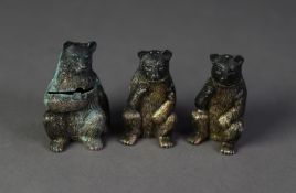 SET OF THREE SILVER SEATED BEAR PATTERN CONDIMENT RECEIVERS, viz pepper and salt with removable