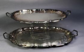 PAIR OF SILVER PLATED SHAPED OVAL TWO-HANDLED LARGE TRAYS, foliate scroll engraved, 23? (58.4cm)