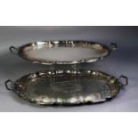 PAIR OF SILVER PLATED SHAPED OVAL TWO-HANDLED LARGE TRAYS, foliate scroll engraved, 23? (58.4cm)