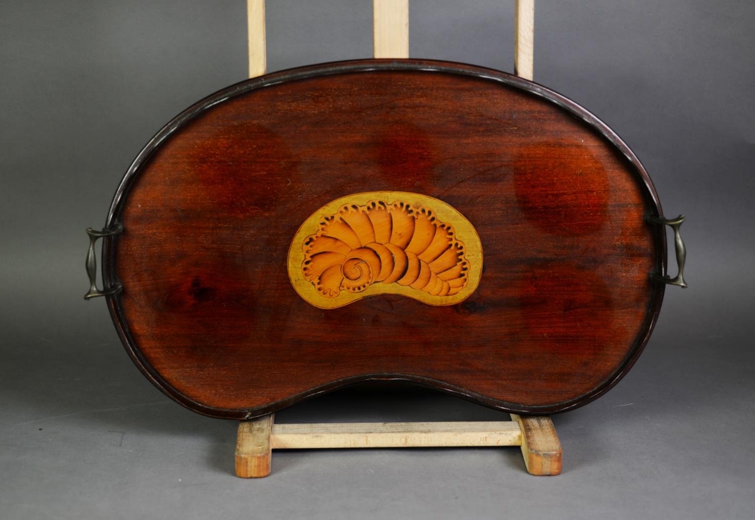 EDWARDIAN INLAID MAHOGANY KIDNEY SHAPED TWO HANDLED TRAY, with shell inlay to the centre and brass