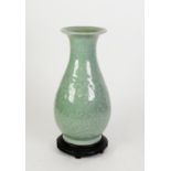 CHINESE LATE QING DYNASTY GREEN STONEWARE CELADON GLAZED BALUSTER SHAPE VASE, moulded in low