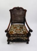 CARVED MAHOGANY FRAMED BERGÈRE LOUNGE ARMCHAIR with cane panel back