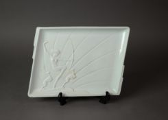 MODERN FRANZ WHITE GLAZED AND MOULDED PORCELAIN SHALLOW DISH, in the Art Deco style, of shaped