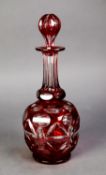 RUBY STAINED AND CUT GLASS GLOBE AND SHAFT SHAPED DECANTER and tear shaped stopper