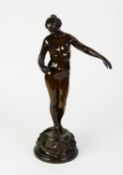 PATINATED BRONZE FEMALE NUDE, modelled standing with her left arm outstretched and holding an oil