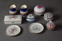 TWO HEREND PORCELAIN SMALL LIDDED, SPHERICAL BOXES AND COVERS, one puce painted with flowers,